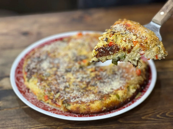 A pizza sitting on top of a white plate.